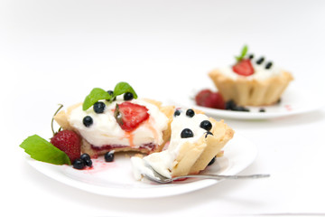 Delicious tarts with berries and cream