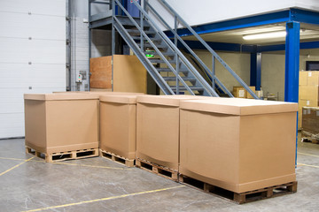 pallets with cartons in warehouse - 15303501