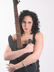 Woman hugging her guitar
