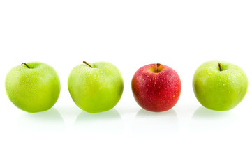 Three green apples with one red apple