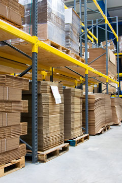 shelves with carboard in warehouse