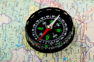 Compass over map backgroun