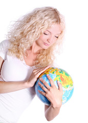 young blond woman holding a globe