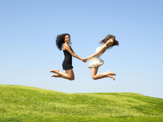 two jumping woman