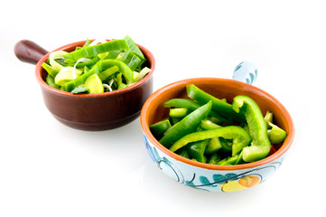 Two bowls with fresh vegetables isolated on white background