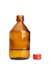 Bottle with liquid and cap near