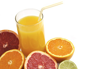 Glass of orange juice with slices of fresh orange, grapefruit an