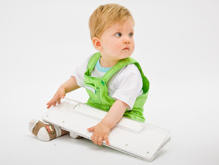 Baby with white keyboard