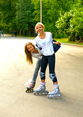 young smiling girls on rollers