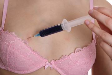 breasts and syringe