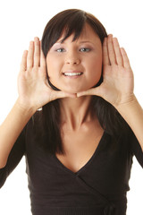 Woman, framing her face with her hands