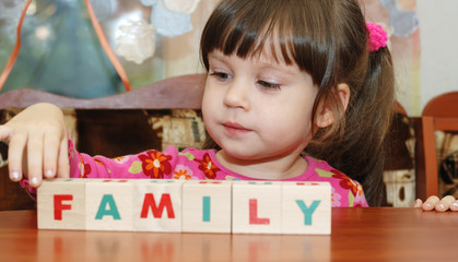 The girl and toy cubes