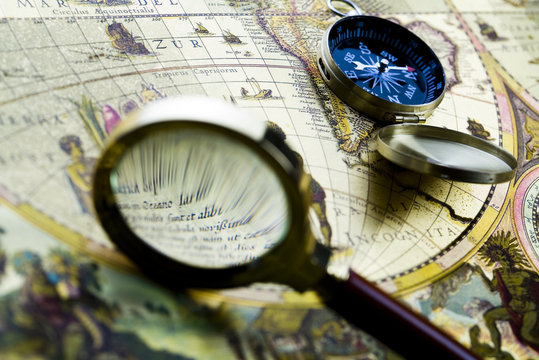 Magnifying glass and old map