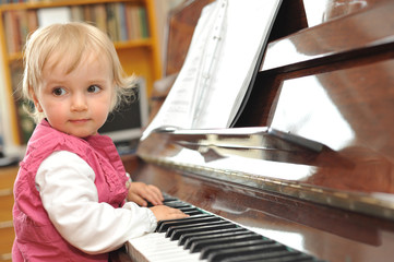 girl plays piano