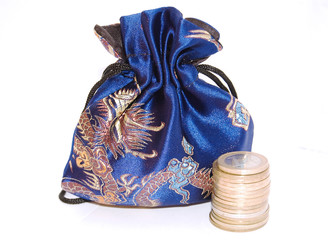 Silky purse and coins isolated on a white background