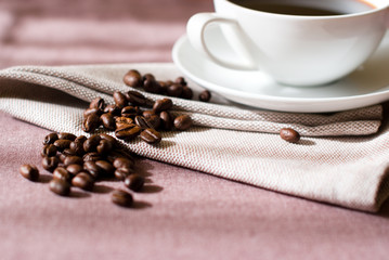 Coffee beans and cup of coffee
