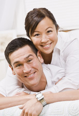 Attractive Couple Hugging and Smiling at the Camera