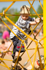 Boy on yellow ropes