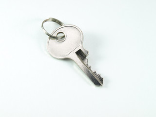 Shiny key on a white background