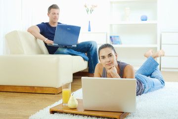 Young couple working at home