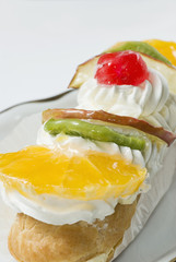 Fruity pastry with fruits and whipped cream