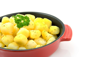 red pan with fresh baked potatoes