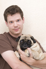Man Holding His Pug