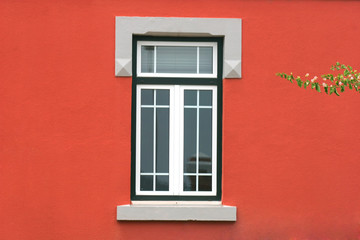 window in red wall