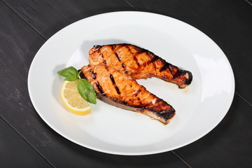 Grilled salmon on the white plate