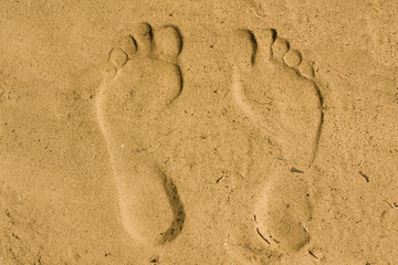 Feet imprint in sand