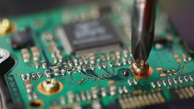 Unscrewing a bolt while disassembling an electronic device