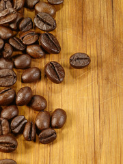coffee beans on the wooden desk as food background