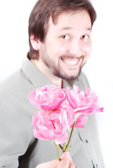 Cute man offering pink roses