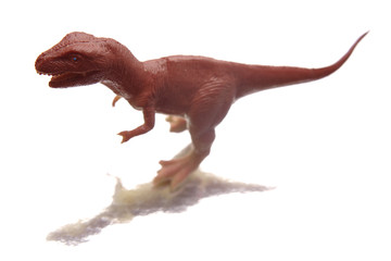 Plastic dinosaur isolated over white background