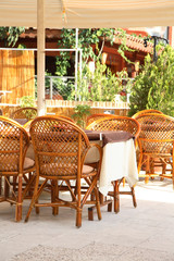 Interior of summer cafe with wattled furniture