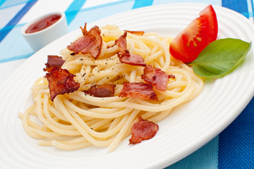 Pasta with fried bacon and vegetables
