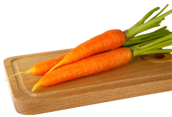 Fresh carrots on the chopping board