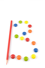 Letter B made of colored smartie