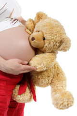 The pregnant woman with a teddy bear