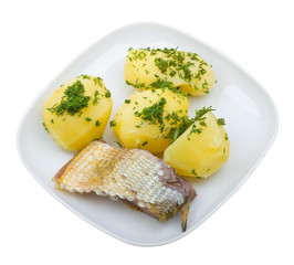 Close-up plate of potato with fish isolated on white