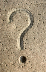 Fototapeta na wymiar Question mark carving on stone