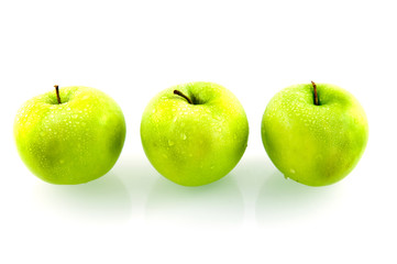 Three green fresh apples on white background