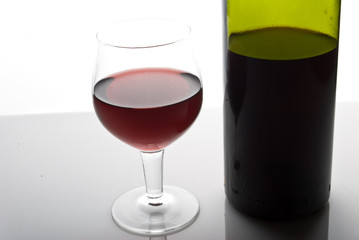 red wine glass and bottle