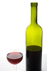red wine glass and bottle