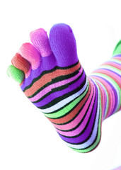 woman legs in strip sock on white background