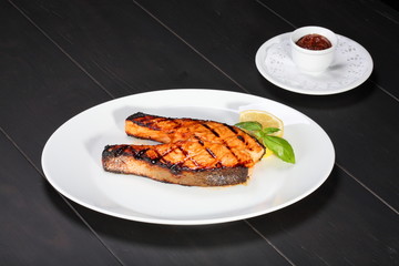 Grilled salmon on the white plate