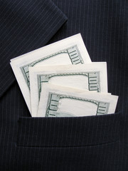 hundred dollars banknotes in pocket of black jacket