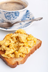 toast with scrambled eggs and coffee