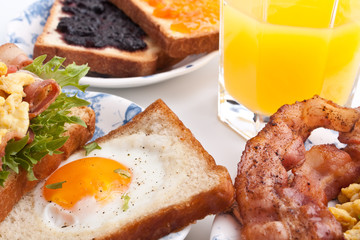 traditional breakfast with juice, eggs and bacon