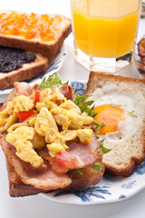 traditional breakfast with juice, eggs and bacon